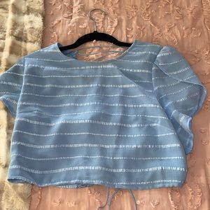 it is a large top and small bottom. The top runs small could fit a medium.